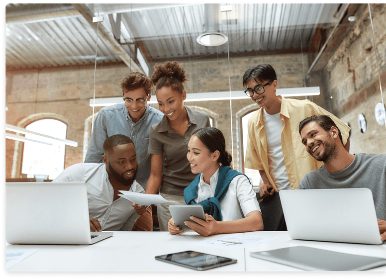 
                  Enthusiastic team of diverse professionals collaborating around a laptop,
                  indicative of QuickBooks-Certified controllers and bookkeepers focused on
                  accurate financial reporting and bookkeeping services.
                