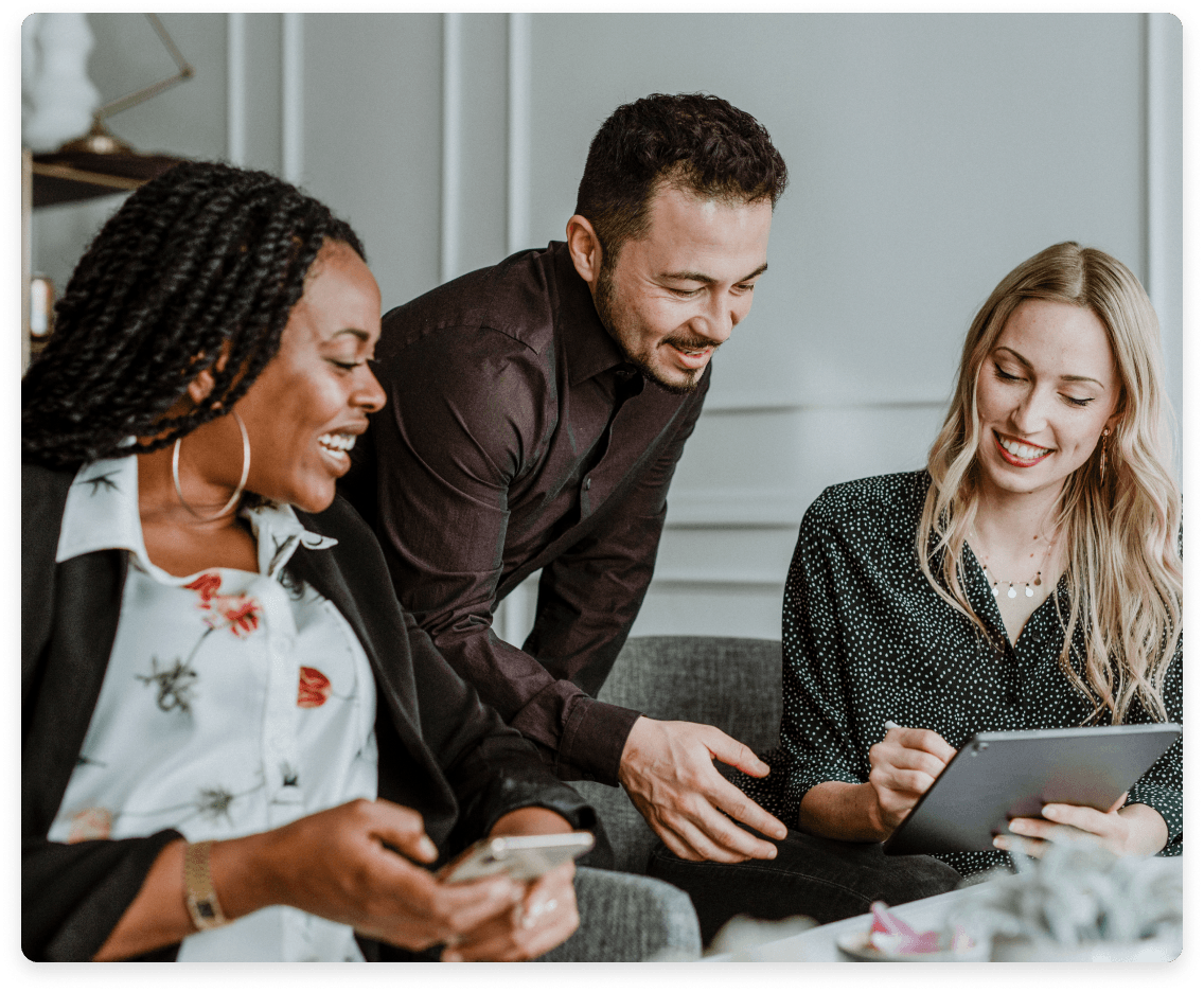 
                  A diverse group of colleagues engaged in a lively discussion with digital tablets,
                  representing a team that values diversity, continuous learning, technological leverage,
                  and a strong commitment to client service.
                